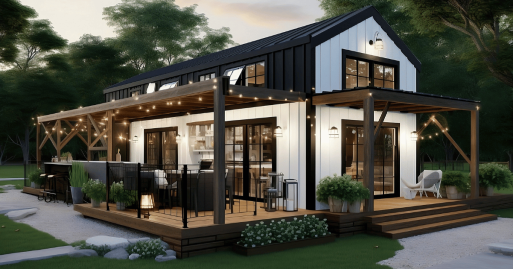 Modern, small barndominium Plans design with a black roof, white siding, and a spacious outdoor deck with string lights and a fireplace.