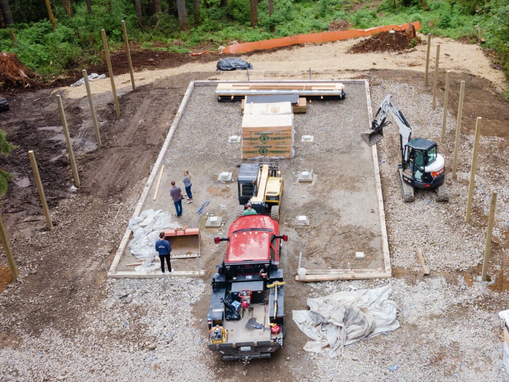 a construction site with construction equipment and people